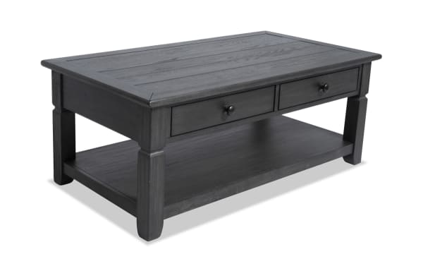 Rustic Laurel Charcoal Storage Coffee Table from Laurel Entertainment & Occasional collection, featuring distressed charcoal finish, two drawers, lower shelf, MDF, rubberwood, and acacia veneers.