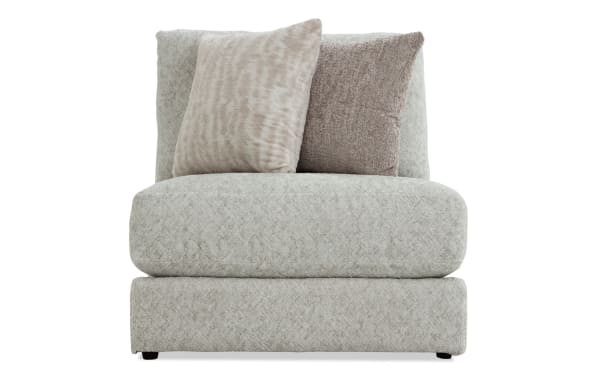 Posh Beige Armless Chair with plush beige polyester fabric upholstery, transitional style, gel-infused memory foam cushion, and two accent pillows.