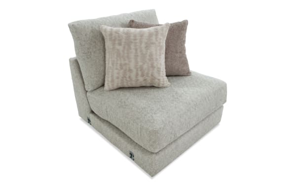 Posh Beige Armless Chair with plush beige polyester fabric upholstery, Bob-O-Pedic Gel Infused Memory Foam, transitional style, and two accent pillows.
