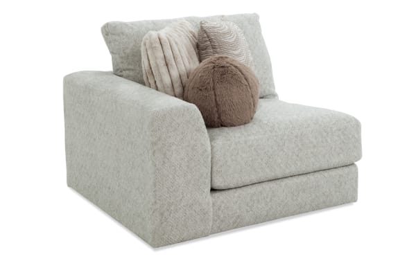 Posh Beige Left Arm Facing Chair with plush beige polyester fabric upholstery, transitional style, gel-infused memory foam cushion, and four decorative accent pillows.
