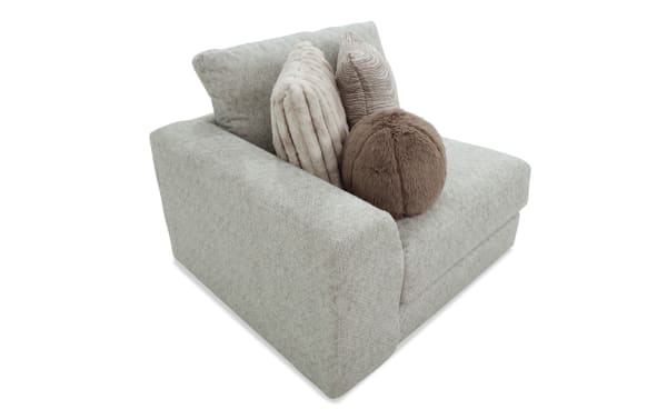 Posh Beige Left Arm Facing Chair in transitional style with plush beige polyester fabric, Bob-O-Pedic gel memory foam, and four decorative accent pillows.