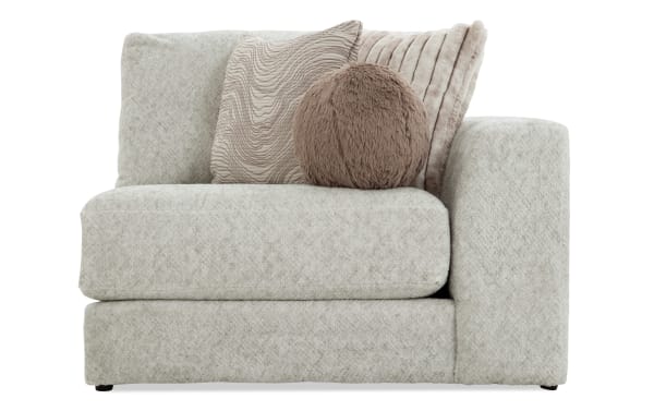 Posh Beige Right Arm Facing Chair with plush beige polyester fabric upholstery, transitional style, Bob-O-Pedic gel memory foam, and four accent pillows.