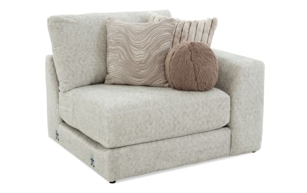 Posh Beige Right Arm Facing Chair with plush beige polyester fabric, Bob-O-Pedic gel memory foam, and four decorative accent pillows, transitional style.
