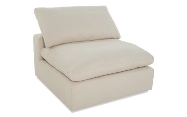 Dream Shell Armless Chair in beige polyester and nylon fabric, transitional style with oversized reversible cushions and feather blend topper.