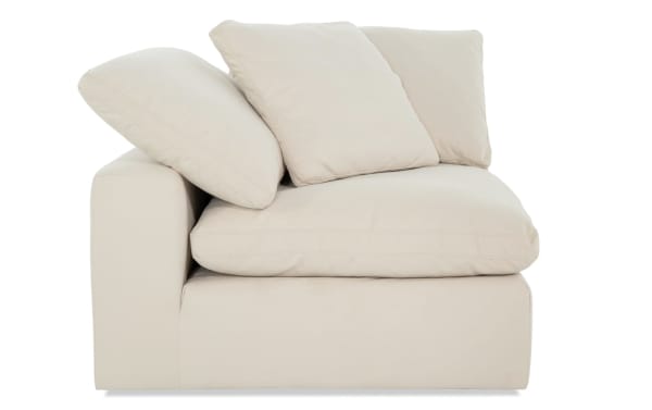 Dream Shell Corner Chair in beige fabric upholstery, transitional style with oversized reversible cushions and included accent pillow.