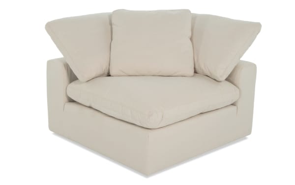 Dream Shell Corner Chair in beige fabric with oversized reversible cushions, feather blend topper, and jersey-knit polyester upholstery. Transitional style modular seating.