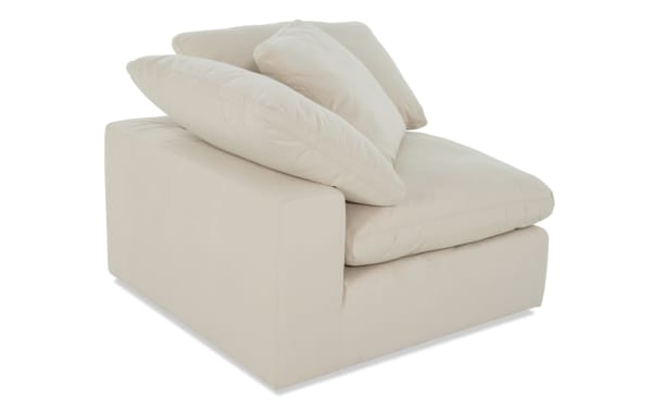 Dream Shell Corner Chair in beige polyester fabric with oversized reversible cushions and accent pillow, transitional style modular seating.