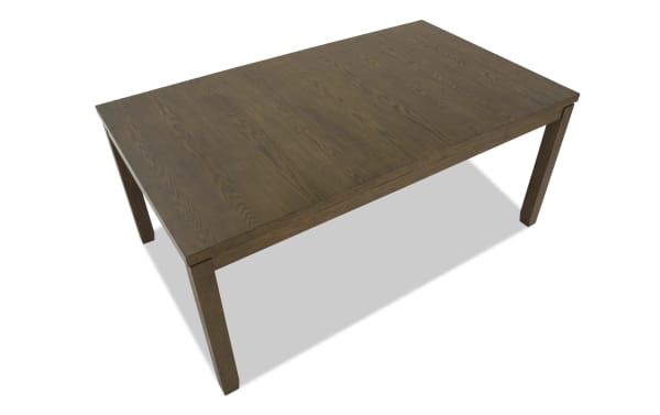 Rectangular wooden dining table with dark brown finish, visible wood grain texture, and sturdy square legs, ideal for home or office use.