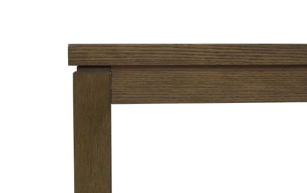 Dark brown wooden table corner showcasing smooth finish and visible wood grain texture, highlighting craftsmanship and sturdy design.