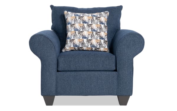 Kylie Navy Chair in blue polyester fabric with rolled arms, plush memory foam cushion, and patterned accent pillow from the transitional Kylie collection.