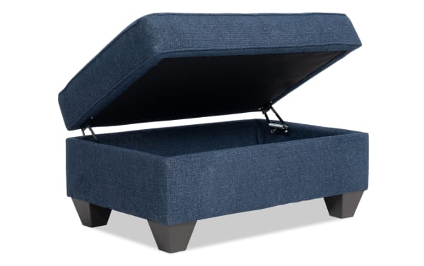 Kylie Navy Storage Ottoman in transitional style with navy polyester fabric, cushioned top, no-sag spring seating, and hidden storage space.