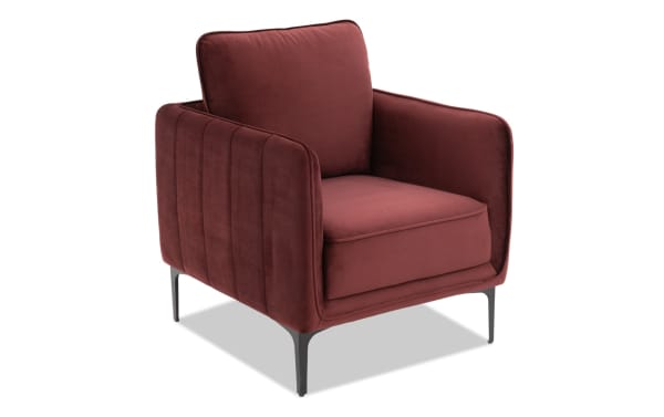 Madeline Berry Accent Chair in contemporary style with plush berry velvet upholstery, cushy foam cushions, slope arms, and sleek metal legs.