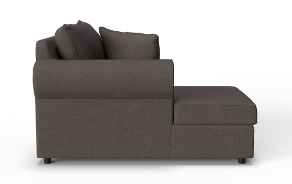 Dark gray fabric sectional sofa with thick cushions and a chaise lounge on the right side, featuring a modern, minimalist design.