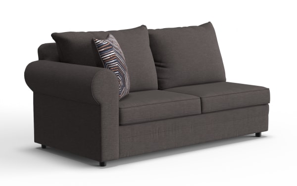Dark gray fabric sofa with rolled armrest, two large back cushions, two seat cushions, and one decorative geometric patterned throw pillow.