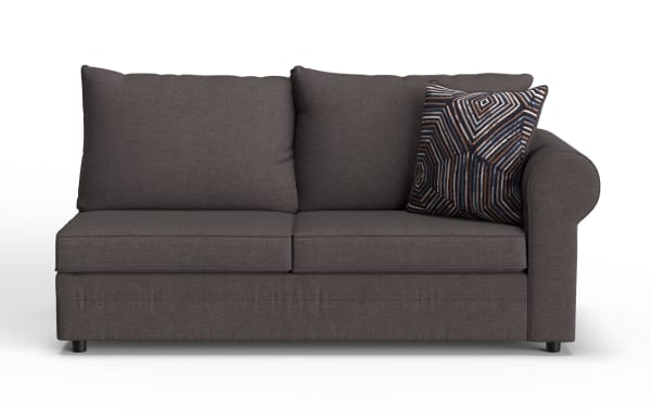 Dark gray fabric loveseat sofa with two large back cushions, a single rolled armrest on the right, and a decorative geometric patterned throw pillow.