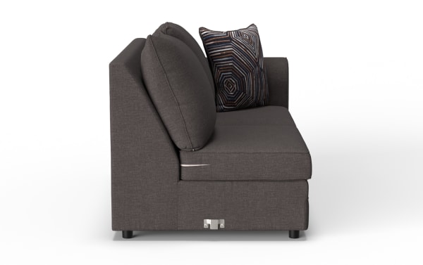 Dark gray fabric sofa with two large matching cushions and one decorative geometric-patterned pillow, modern style, side view.