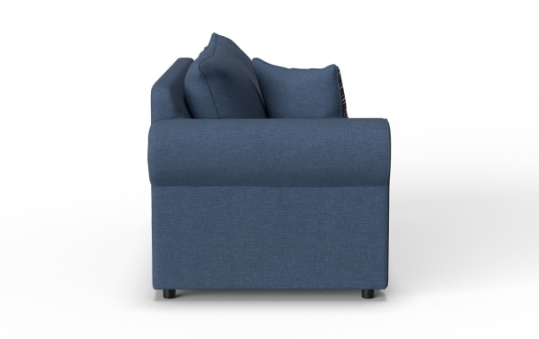 Blue fabric sofa side view showing cushioned armrest, plush back pillows, and short black legs, suitable for modern living rooms.