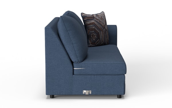 Blue fabric upholstered modern sofa with two large back cushions and one decorative geometric patterned pillow, side view.