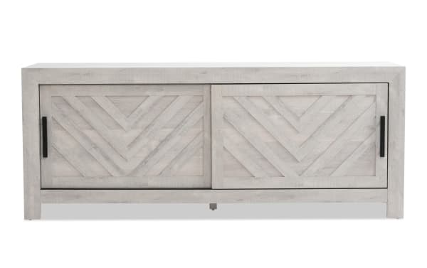 Calvin 65'' White TV Stand from Calvin Entertainment & Occasional, transitional MDF design with chevron plank pattern, sliding doors, and wood grain finish.