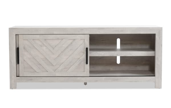 Calvin 65'' white MDF TV stand from Calvin Entertainment & Occasional collection, transitional style with chevron plank design, sliding door, adjustable shelves, and cord management.