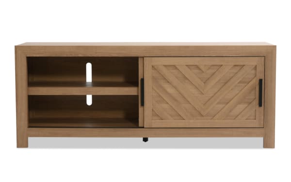 Calvin 65'' light brown MDF TV stand from Calvin Entertainment & Occasional collection, transitional style with chevron plank design, sliding doors, adjustable shelves, and cord management.