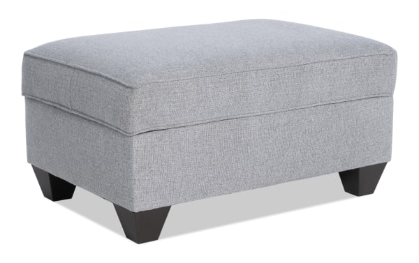 Kylie Gray Storage Ottoman in gray polyester fabric, transitional style with cushioned top, no-sag spring seating, and hidden storage compartment.