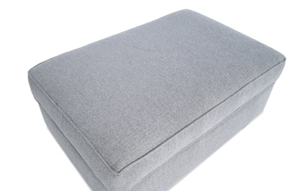 Gray Kylie Gray Storage Ottoman with soft polyester fabric upholstery, transitional style, cushioned top, and hidden storage for pillows and blankets.