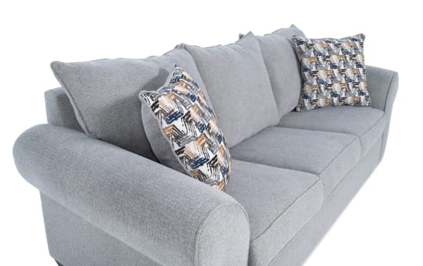 Kylie Gray 92'' transitional sofa with gray polyester fabric upholstery, roll arms, memory foam cushions, and patterned accent pillows.