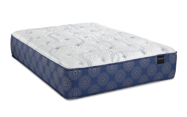 Indulgence 15'' Queen Ultra Plush Mattress with gel-infused foam, graphite Talalay latex, memory foam, and coil system in blue floral cover.