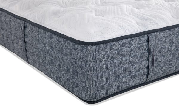 Envy 15.5'' Twin XL Firm Mattress with hand-tufted white Tencel knit cover, gray quilted sides, and hybrid layers of silk, wool, gel memory foam, and 2,000 micro coils for firm support and temperature regulation.