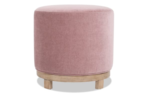Eden Petal Swivel Ottoman in pink polyester fabric with transitional style, 360-degree swivel, and natural wood base with short legs.