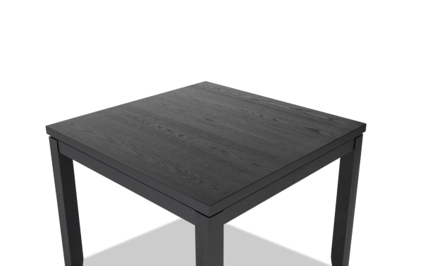Brookline Black Square Dining Table in transitional style, crafted from solid acacia, rubberwood, MDF, and oak veneers with a smooth black wood finish.