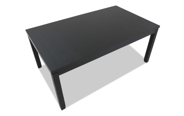 Brookline Black Dining Table in transitional style with solid acacia, MDF, rubberwood, and oak veneers, featuring a sleek black rectangular top and sturdy legs.