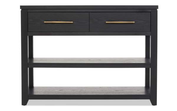 Black wooden console table with two drawers featuring gold handles, and two open shelves for storage, modern minimalist design.