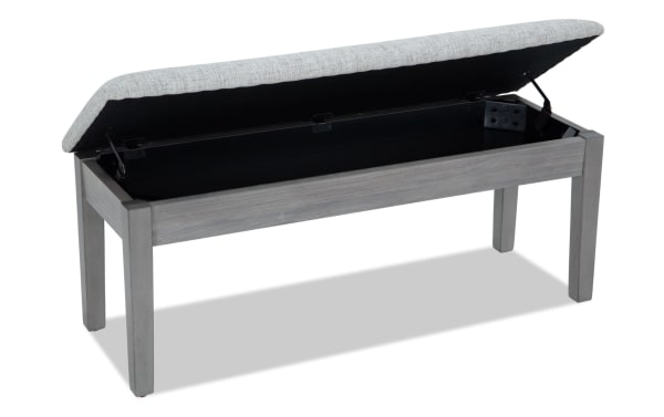 Homeworks Gray Upholstered Storage Dining Bench with cushioned polyester seat, lift-top storage, and durable gray wood frame in transitional style.