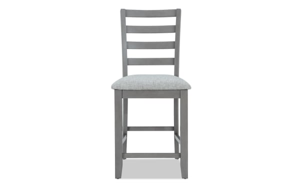 Homeworks Gray Ladder Back Counter Height Stool with cushioned polyester fabric seat, durable rubberwood frame, and transitional style.