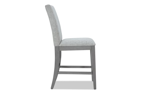 Homeworks Gray Solid Back Upholstered Counter Height Stool with cushioned polyester fabric seat, gray wooden frame, transitional style, durable wood materials.
