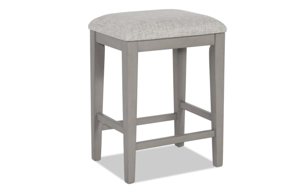Homeworks Gray Backless Upholstered Counter Height Stool with cushioned Bob-O-Pedic Memory Foam seat, gray fabric polyester upholstery, and durable wooden frame in transitional style.