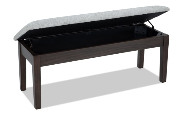 Homeworks Dark Brown & Gray Upholstered Storage Dining Bench with cushioned gray polyester seat, lift-top storage, and durable dark wood frame in transitional style.