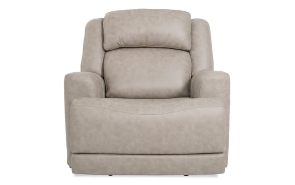Beige Zeus Living traditional power lift recliner with plush polyester fabric, cushioned headrest, wide seat, and padded armrests for comfort.