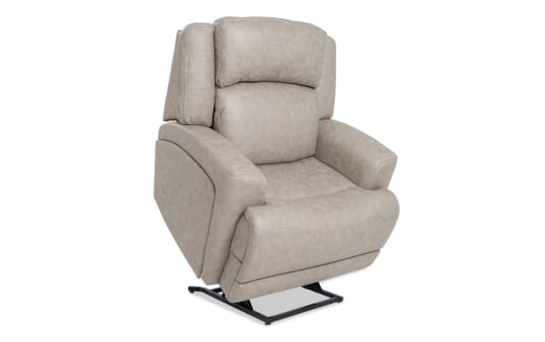 Beige Zeus Living traditional power lift recliner with polyester fabric upholstery, power headrest, massage, heat, lumbar support, and wide seat.