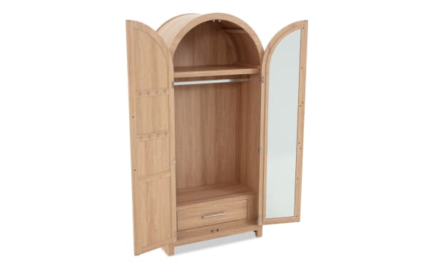 Wooden wardrobe with arched top, natural oak finish, two doors including one with full-length mirror, hanging rod, shelf, and bottom drawer.