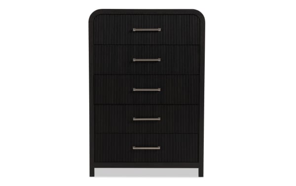Cascade Black 5 Drawer Chest from the Cascade Bedroom collection, featuring transitional style, black MDF with engineered wood grain, reeded drawer fronts, rounded corners, and a felt-lined top drawer for elegant storage.