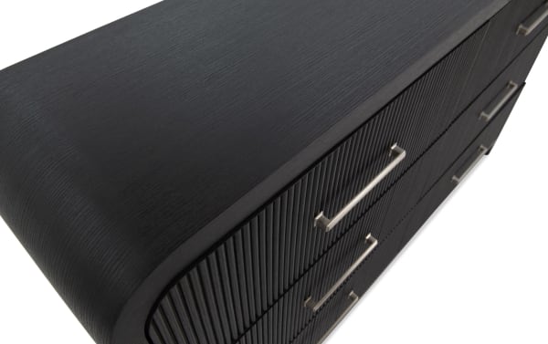Cascade Black 6 Drawer Dresser in transitional style, featuring smooth rounded corners, black engineered wood grain MDF, and intricately reeded drawer fronts with silver handles.