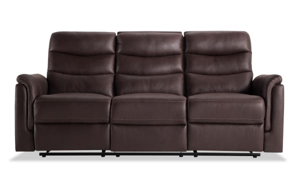Forte Chocolate 82'' manual reclining sofa in brown polyester fabric with padded arms, memory foam seating, and contrasting stitch design, transitional style.