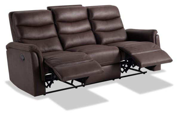 Forte Chocolate 82'' manual reclining sofa in brown polyester fabric with padded arms, memory foam seating, contrasting stitch, and transitional style.