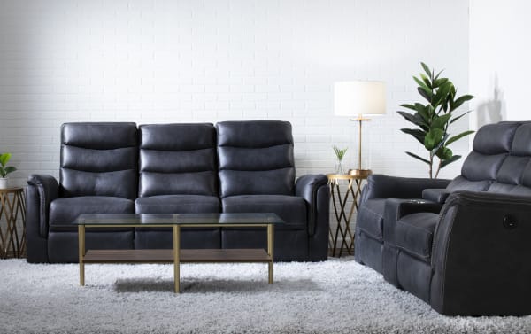 Forte Charcoal 72'' power reclining console loveseat in gray polyester fabric with padded arms, memory foam seating, USB port, and gliding storage console.
