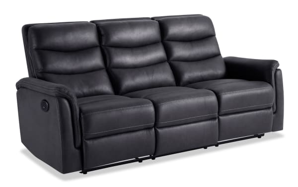 Forte Charcoal 82'' power reclining sofa in gray polyester fabric with padded arms, memory foam seating, contrasting stitch, and USB charging port.