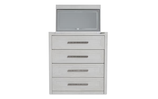 Four-drawer white wood dresser with textured panel fronts and metal bar handles, featuring a top flip-up compartment with a frosted glass panel.