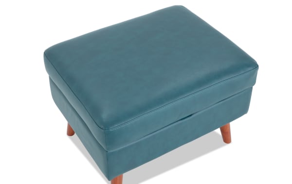 Bettie Teal Faux Leather Storage Ottoman in mid-century modern style with cushioned teal faux leather top, wooden legs, and hidden storage compartment.